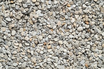 Photo of Pile of small pebble stones. Background texture for backdrops or mapping