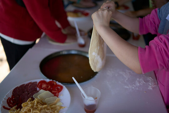 a workshop for children on cooking pizza in an old wood-fired oven
