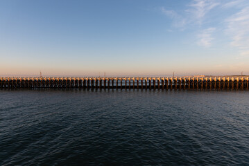 Fototapeta premium Old wooden pier on the sea shore