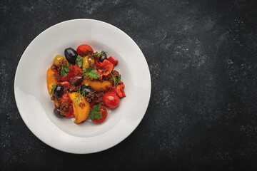 Vegetable salad with olives on a plate