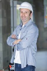 handsome repairman with arms crossed