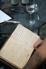 person writing on a book