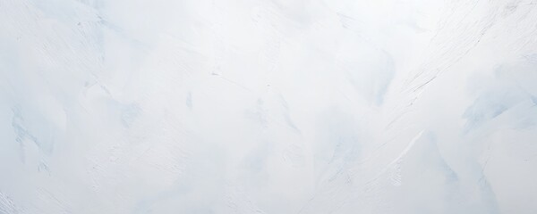 Obraz premium A smooth white marble surface with subtle veins under natural light, creating an elegant and serene atmosphere for design projects