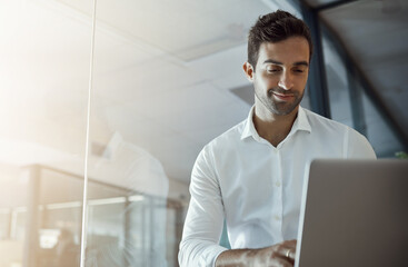 Business, man and typing with laptop in office for finance planning, budget report and proposal email. Smile, male accountant and digital with payment schedule, review feedback and investment growth