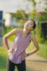 Asian girl exercising in the park. Fitness girl jogging for her own health.