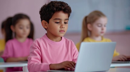 Focused children learning with laptops in a classroom setting.