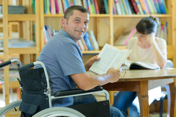 man in wheelchair looking at camera