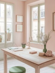 Fototapeta premium : A workspace with soft pink walls, a cream wooden desk, and mint green accents on accessories