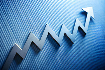 A silver arrow pointing upwards on a blue background. The arrow is surrounded by a series of zigzag lines