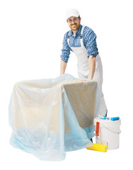 Professional painter covering furniture with a dust sheet © StockPhotoPro