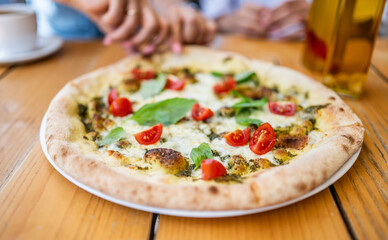 Taking A Piece Of Tasty Vegetarian Pizza At The Cafe With Hands