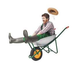 Funny gardener inside a wheelbarrow