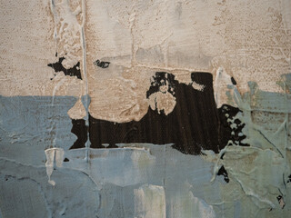 Old yellowed, dilapidated and uneven wall, painted with whitening. Texture and background of...