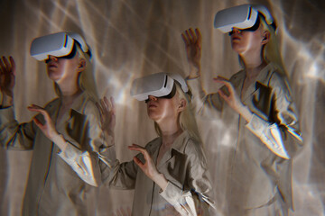 Multiple exposure studio shot of futuristic girl with albinism wearing VR headset exploring...