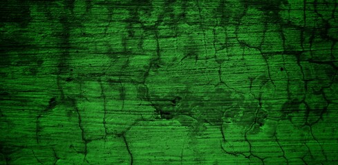 Obraz premium the long wall background is green, blank uncoated canvas or scrim for background long and wide panoramic banner background from rough linen dark green cloth or burlap