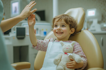 Happy child with toy smiling at dental office visit