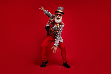 Photo of eccentric positive nice man wear stylish suit jacket summer glasses have fun party isolated on red color background