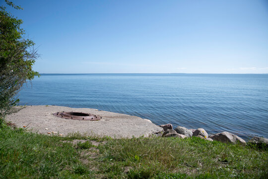the blue water of the kattegat at trelde naes in denmark with blue water and sky