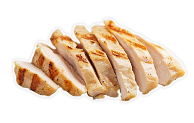 Close up of sliced grilled chicken breast on a black background