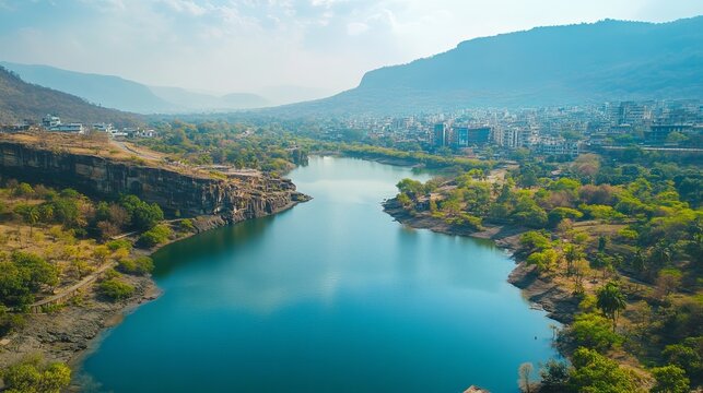 Pune offers a stunning view of Katraj, where lush greenery meets rolling hills under a clear sky. 