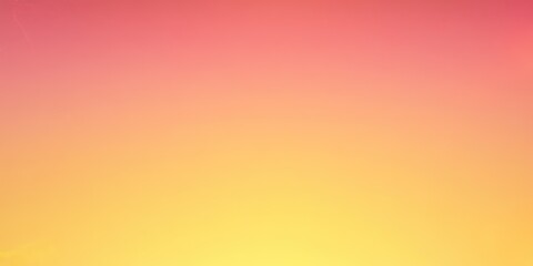 Obraz premium A vibrant gradient background transitioning from pink to yellow.