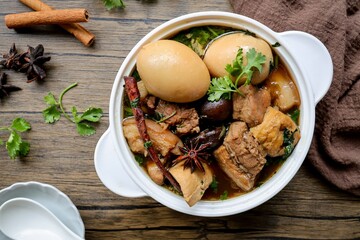 Seasoned eggs, hard boiled eggs and  pork belly  in Chinese Five Spices Sauce,Five Spice Egg with pork, thai called kai pa lo, boiled eggs and pork in brown soup
