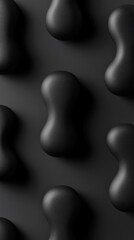 A textured black surface featuring rounded, abstract shapes in a repeating pattern.