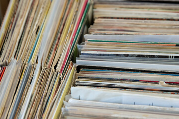 Close up of box of '7 inch singles' vinyl records inside house
