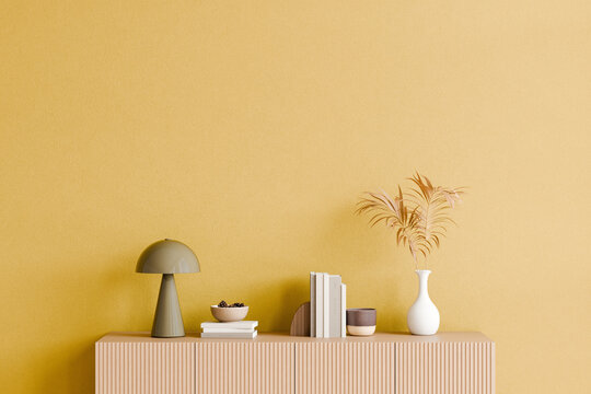 Minimalist interior with yellow wall and decor items. 3d render.
