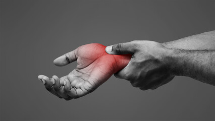 Carpal tunnel pain. Black guy massaging painful wrist, close up