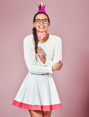 Happy, portrait and woman with lollipop in studio for sweet snack, costume and stylish fashion....