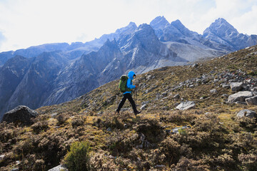 Woman hiking on high altitude mountains