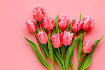 Fototapeta premium Beautiful composition spring flowers. Bouquet of pink tulips flowers on pastel pink background. Valentine's Day, Easter, Birthday, Happy Women's Day, Mother's Day. Flat lay, top view, copy space
