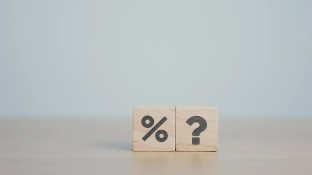 wood block of Question mark and Percentage. Interest rate, GDP, stocks market, financial, deflation and Inflation, ranking, mortgage, debt, Loan and Economic Recession