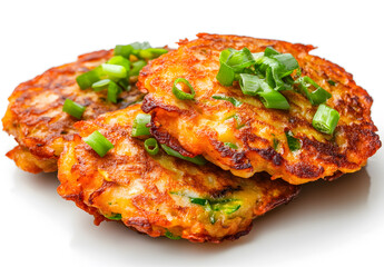 Crispy vegetable pancakes garnished with scallions isolated on white background