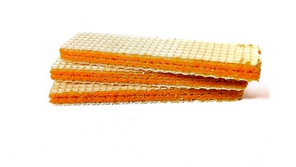 three layered wafers, with cheese paste, on an isolated white background