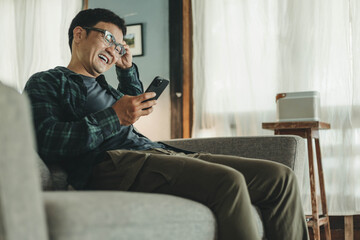 Fototapeta premium man using cell phone holding mobile texting message contact us.chatting,search internet shopping online.technology device communication connecting
