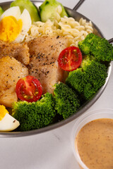 angle view dish of sole fish with eggs and fusilli and cauliflower at vertical composition