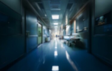A blurry view down a hospital hallway with bokeh from light fixtures in the background.