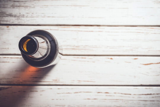 Beer bottle on an old white wooden table