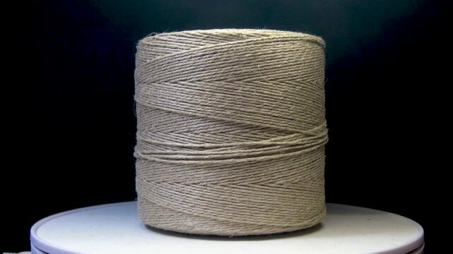 Rotating spool of fine twine rope