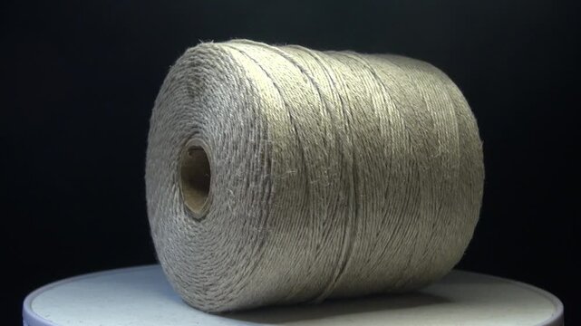 Rotating spool of fine twine rope