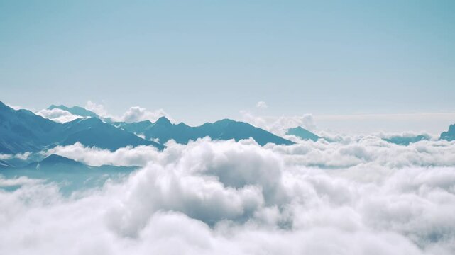 Static banner Timelapse wide 4k shot capturing waves of inversion clouds rolling between mountain peaks on sunrise and clear blue sky above title text copy space background. Rolling cumulus clouds