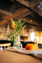 Minimalist Floral Arrangement with fruits and linen on a Wooden Table