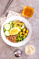 backwheat and vegetables on white plate