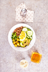 backwheat and vegetables on white plate