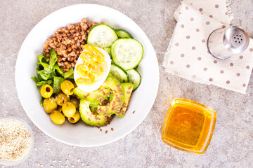 backwheat and vegetables on white plate