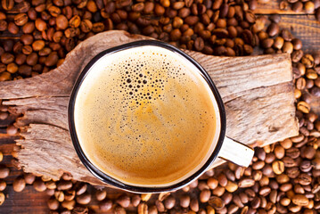 Coffee cup and coffee beans on gray background