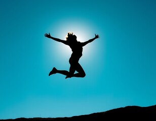 A person jumps high into the air, their body fully extended in mid-motion, creating a dynamic silhouette against a crisp, clear blue sky.