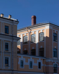 Historic paper mill building and brick chimney in the old part of St. Petersburg, Russia.